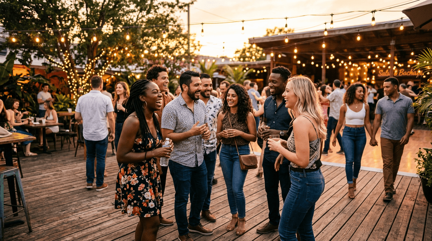 Diverse group of dancers laughing and socializing at an outdoor Latin dance event